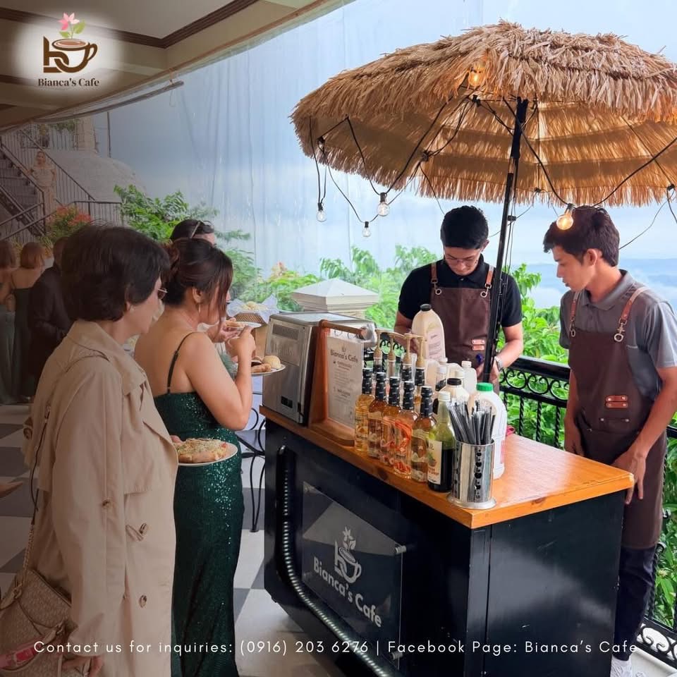 Bianca’s Café coffee cart serving guests at an event